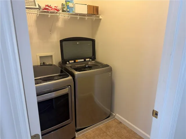 a utility room with dryer and washer