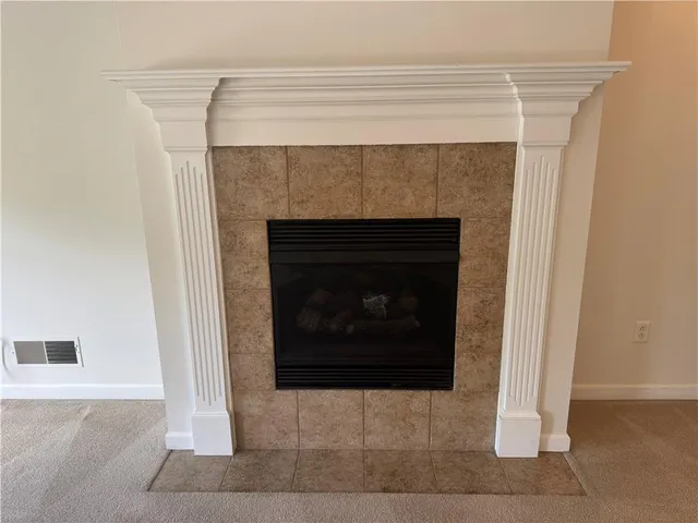 a living room with a fireplace
