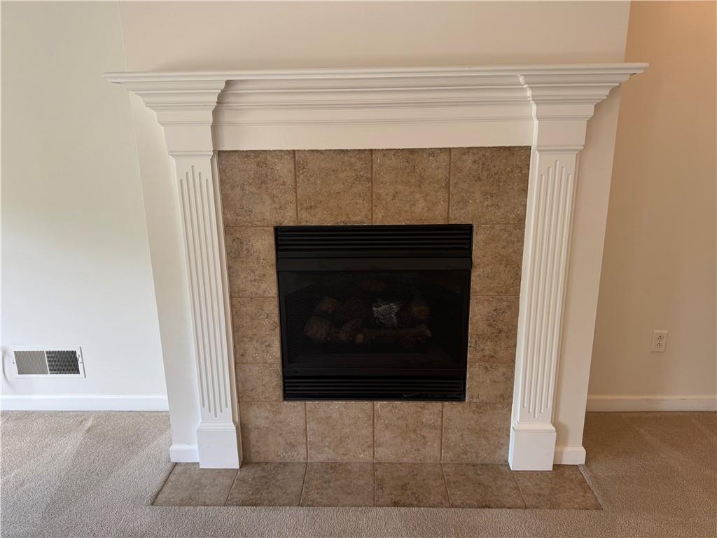 523 East Vanderbilt Drive Mars, PA 16046 - Photo 9 of 32 a living room with a fireplace