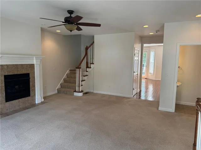 a view of an empty room with a fireplace