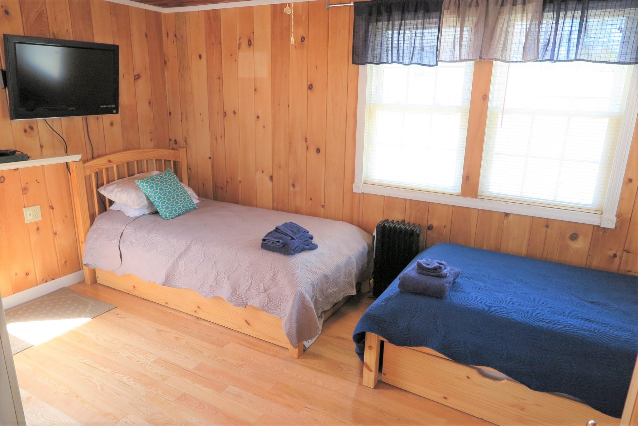 25 Susan Ruth Road Dennis Port, MA 02639 - Photo 20 of 40 a bedroom with a bed window and flat screen tv