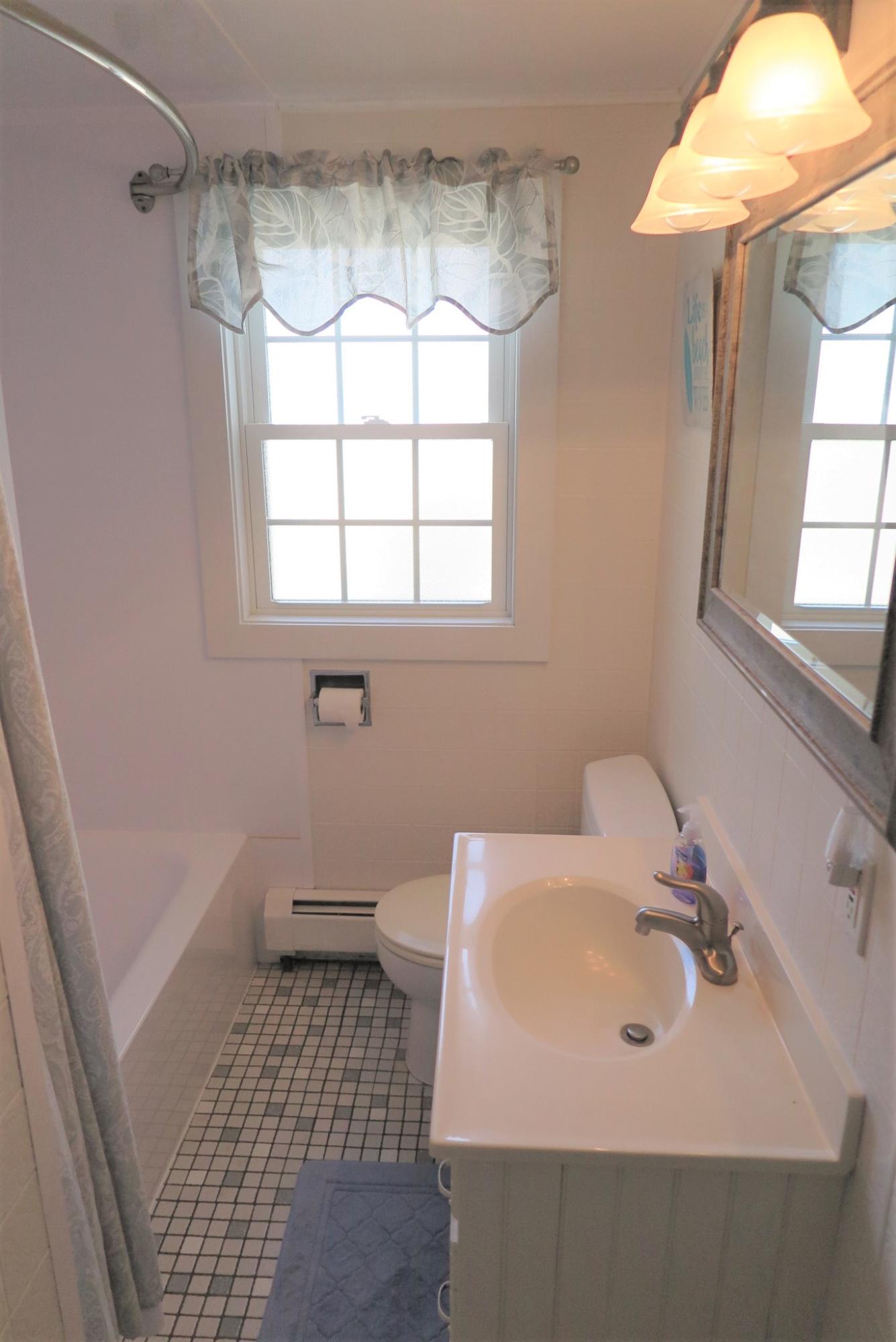 25 Susan Ruth Road Dennis Port, MA 02639 - Photo 25 of 40 a bathroom with a sink a toilet and shower
