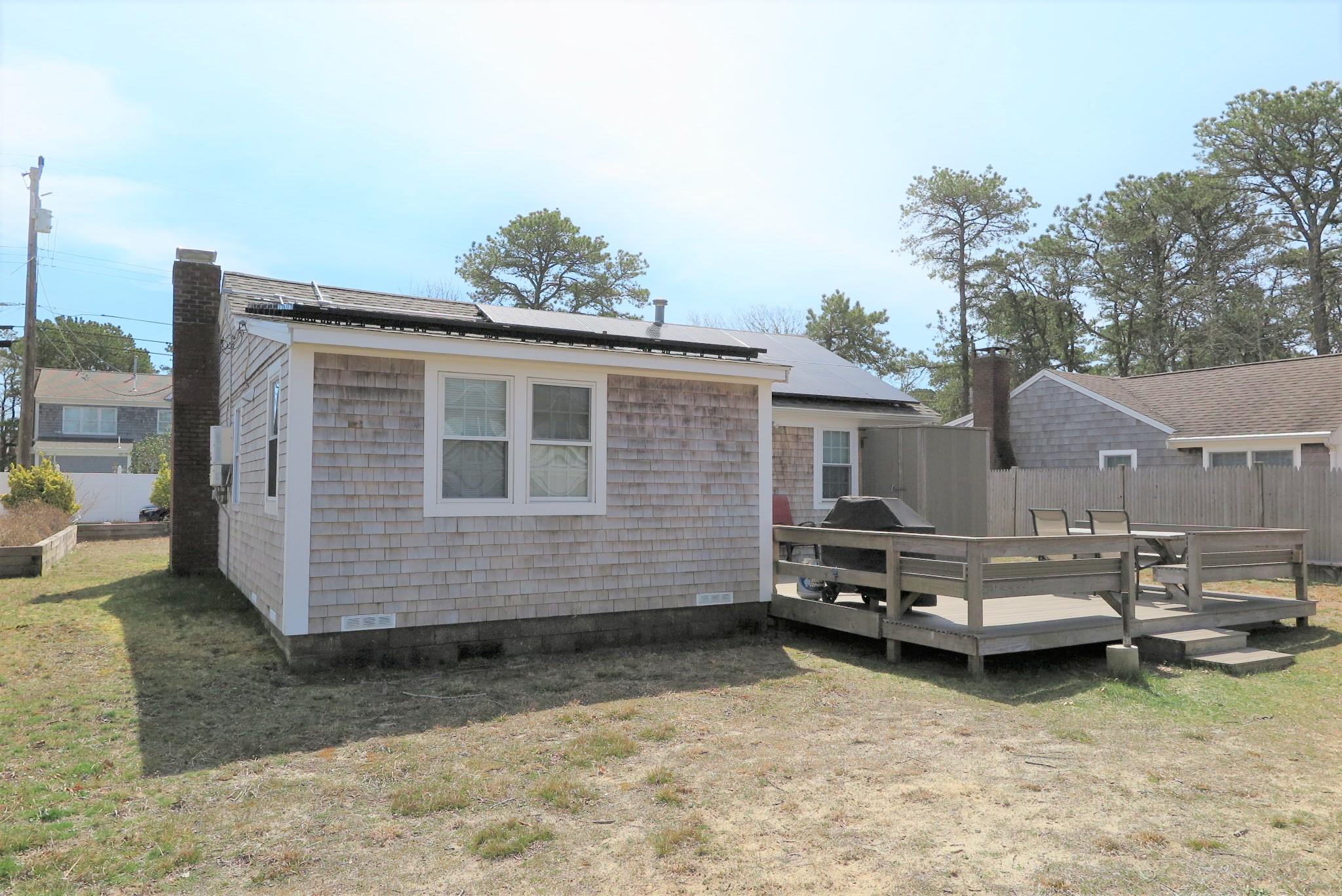 25 Susan Ruth Road Dennis Port, MA 02639 - Photo 30 of 40 a view of a house with a yard and sitting area