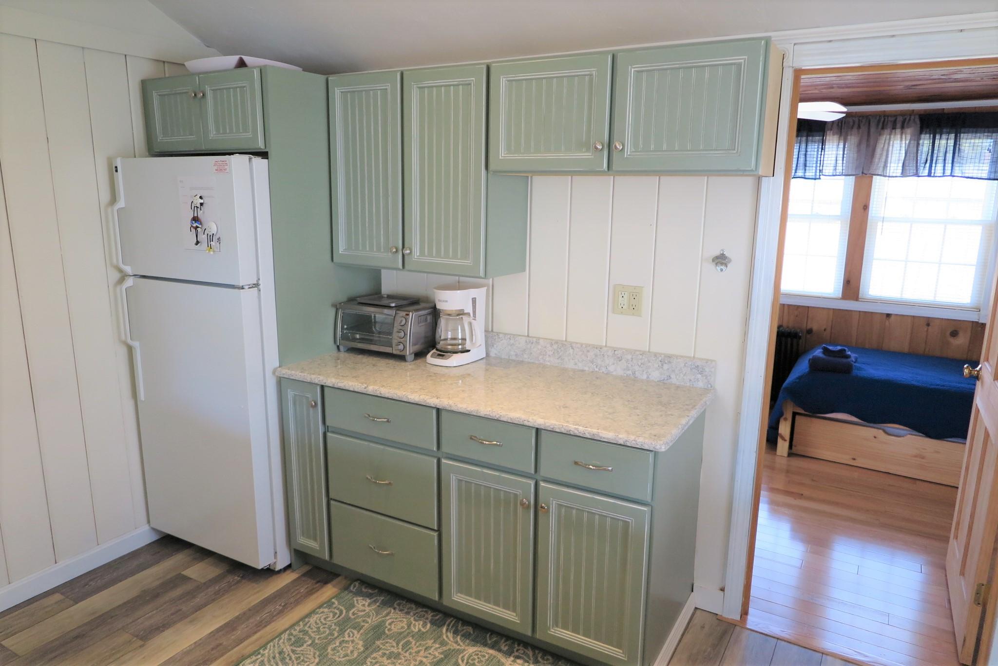 25 Susan Ruth Road Dennis Port, MA 02639 - Photo 10 of 40 a kitchen with a refrigerator and a sink