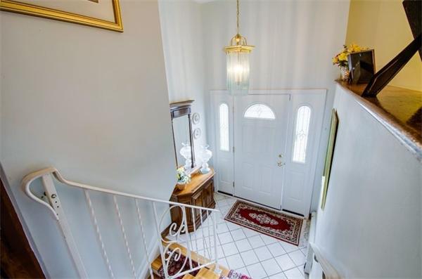 19 Thistle Road Burlington, MA 01803 - Photo 3 of 14 a view of a hallway with wooden floor and stairs
