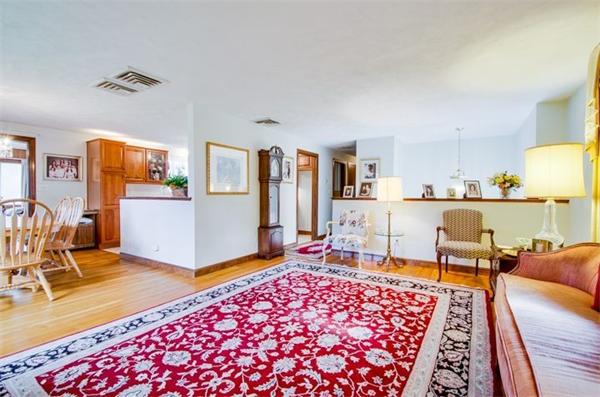 19 Thistle Road Burlington, MA 01803 - Photo 5 of 14 a living room with furniture and a table