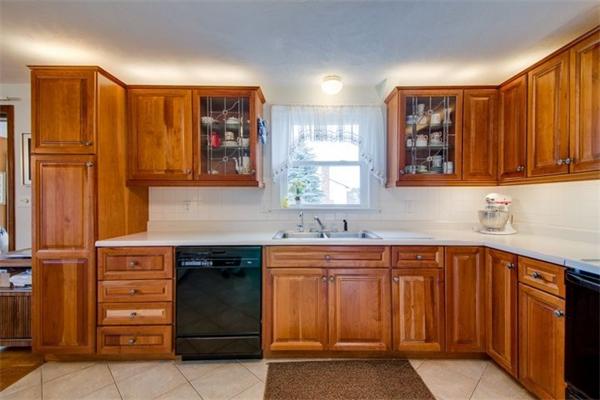 19 Thistle Road Burlington, MA 01803 - Photo 8 of 14 a kitchen with stainless steel appliances granite countertop wooden cabinets a sink and dishwasher