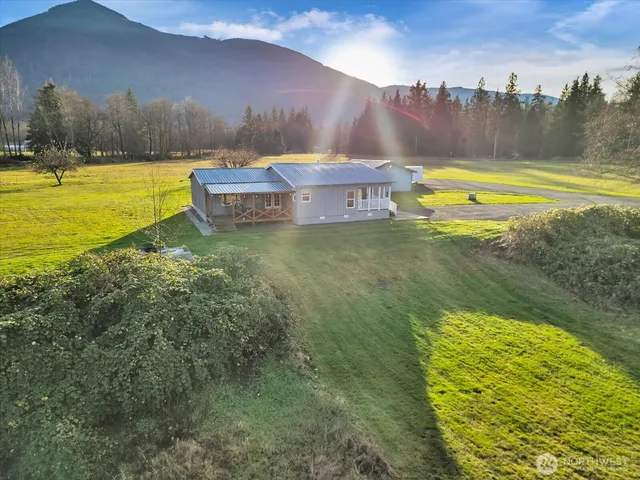 a view of a swimming pool with an outdoor space and seating area