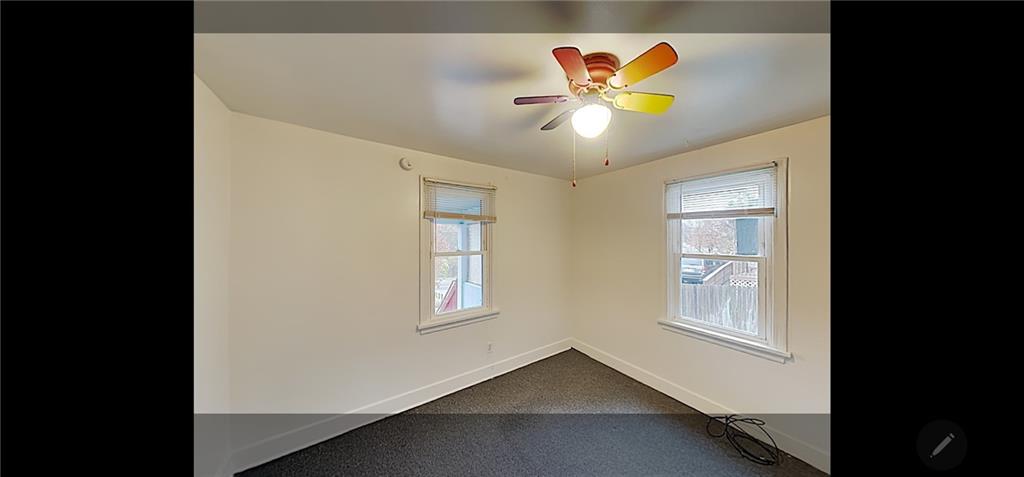 3204 Universal Road Pittsburgh, PA 15235 - Photo 6 of 12 a view of an empty room with window and cabinet