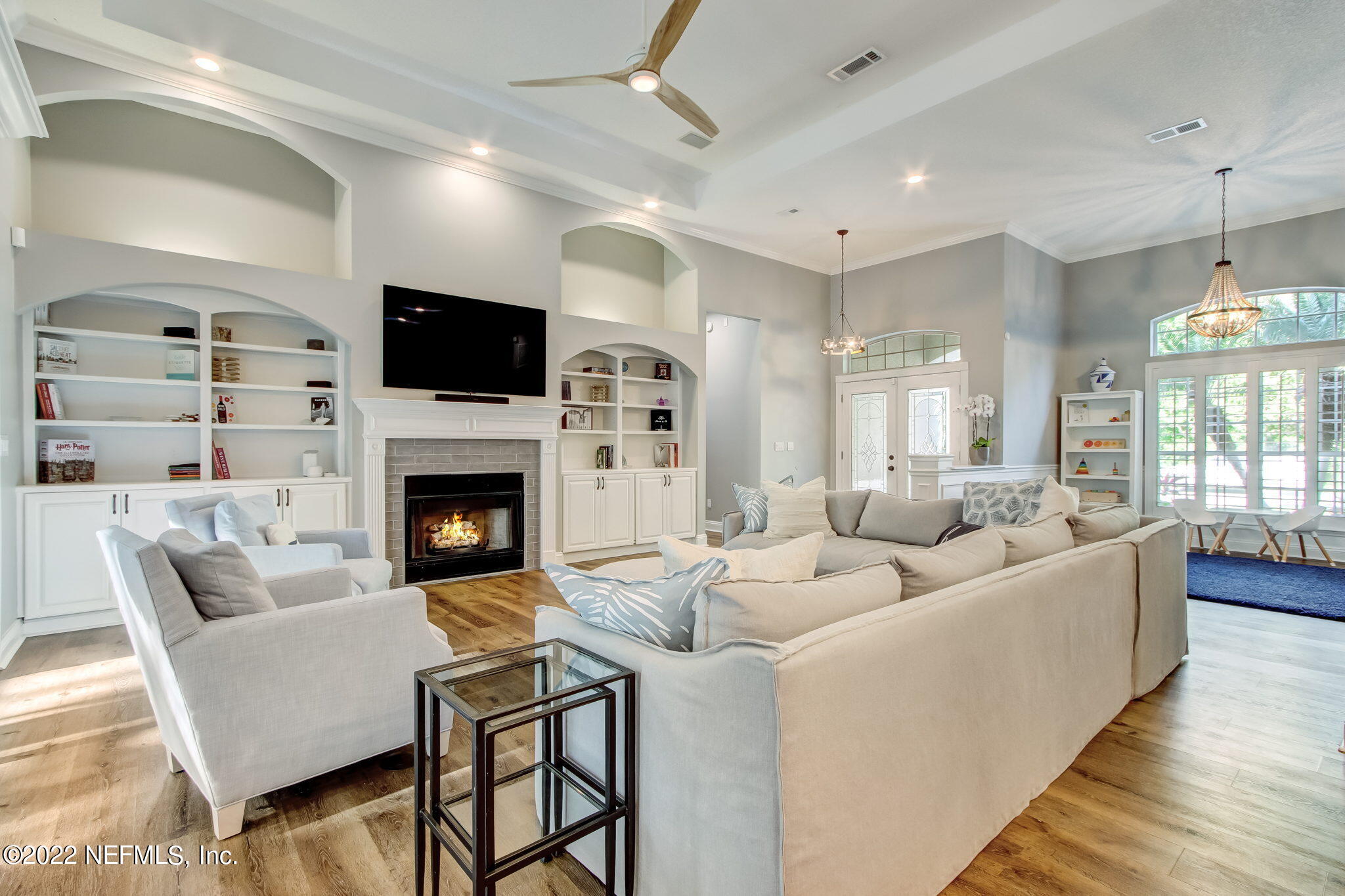 772 Mill Stream Road Ponte Vedra Beach, FL 32082 - Photo 10 of 57 a living room with furniture a fireplace and a flat screen tv