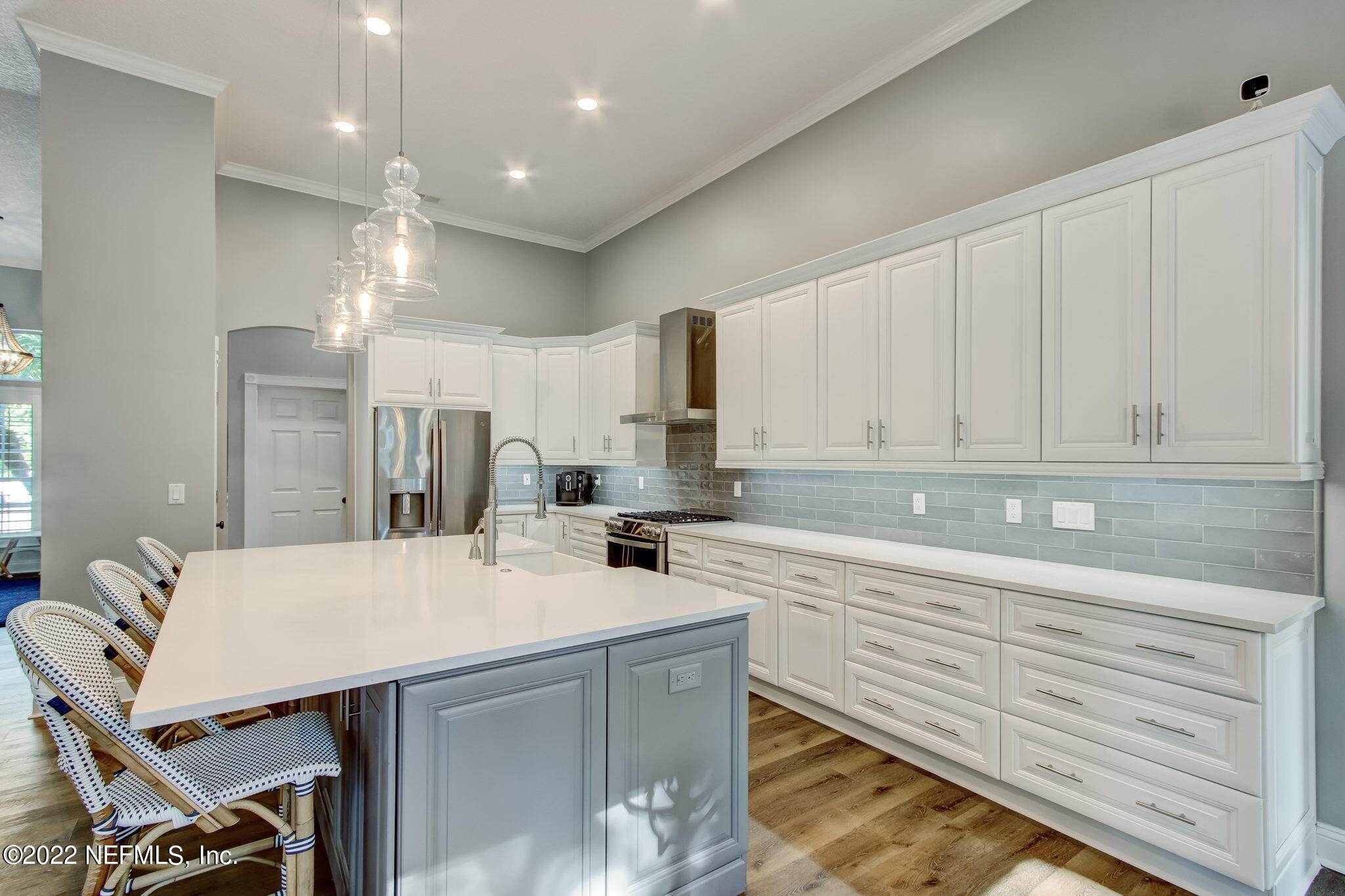 772 Mill Stream Road Ponte Vedra Beach, FL 32082 - Photo 16 of 57 a kitchen with kitchen island a sink table and chairs