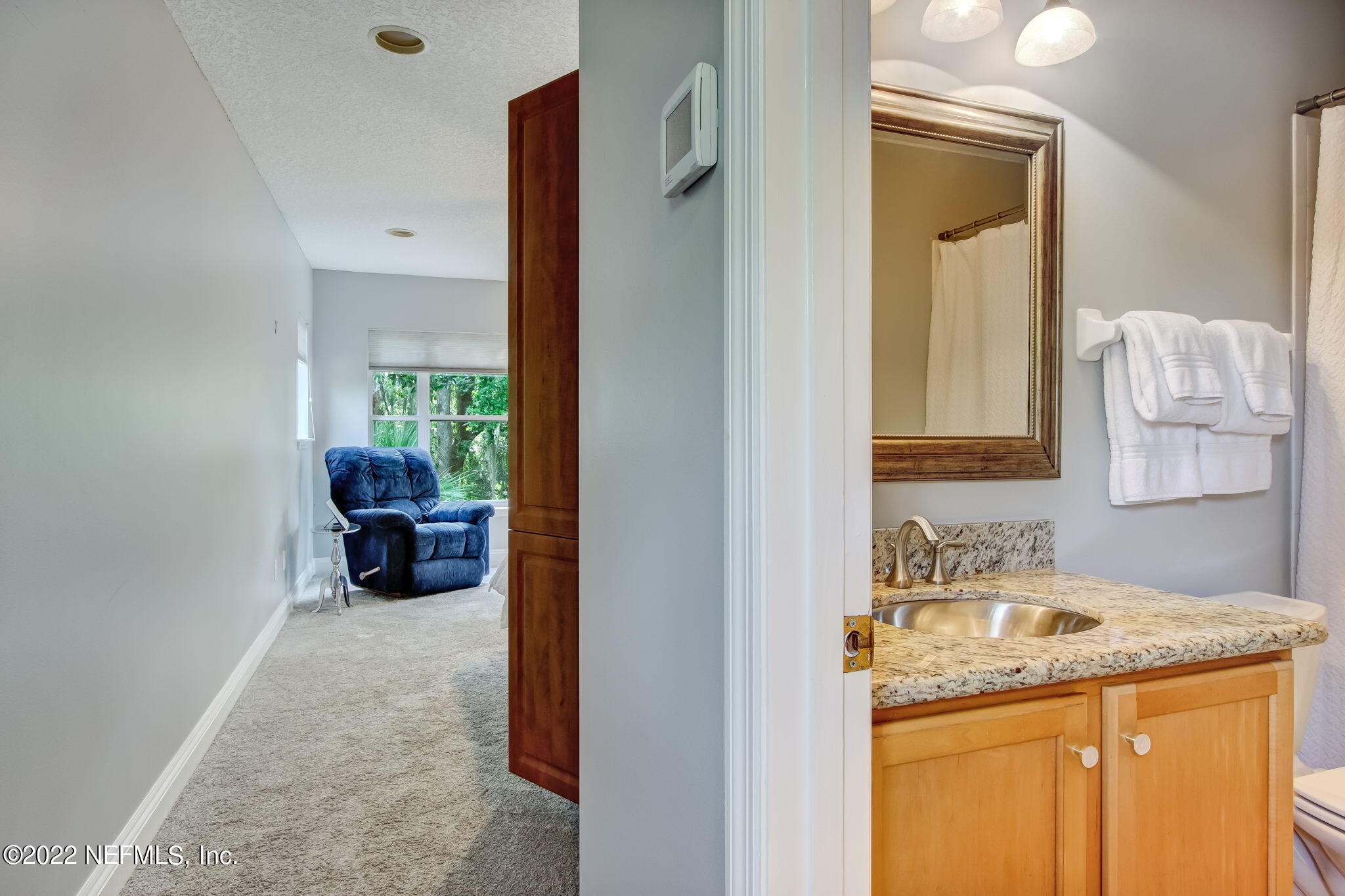 772 Mill Stream Road Ponte Vedra Beach, FL 32082 - Photo 31 of 57 a bathroom with a granite countertop sink and a mirror