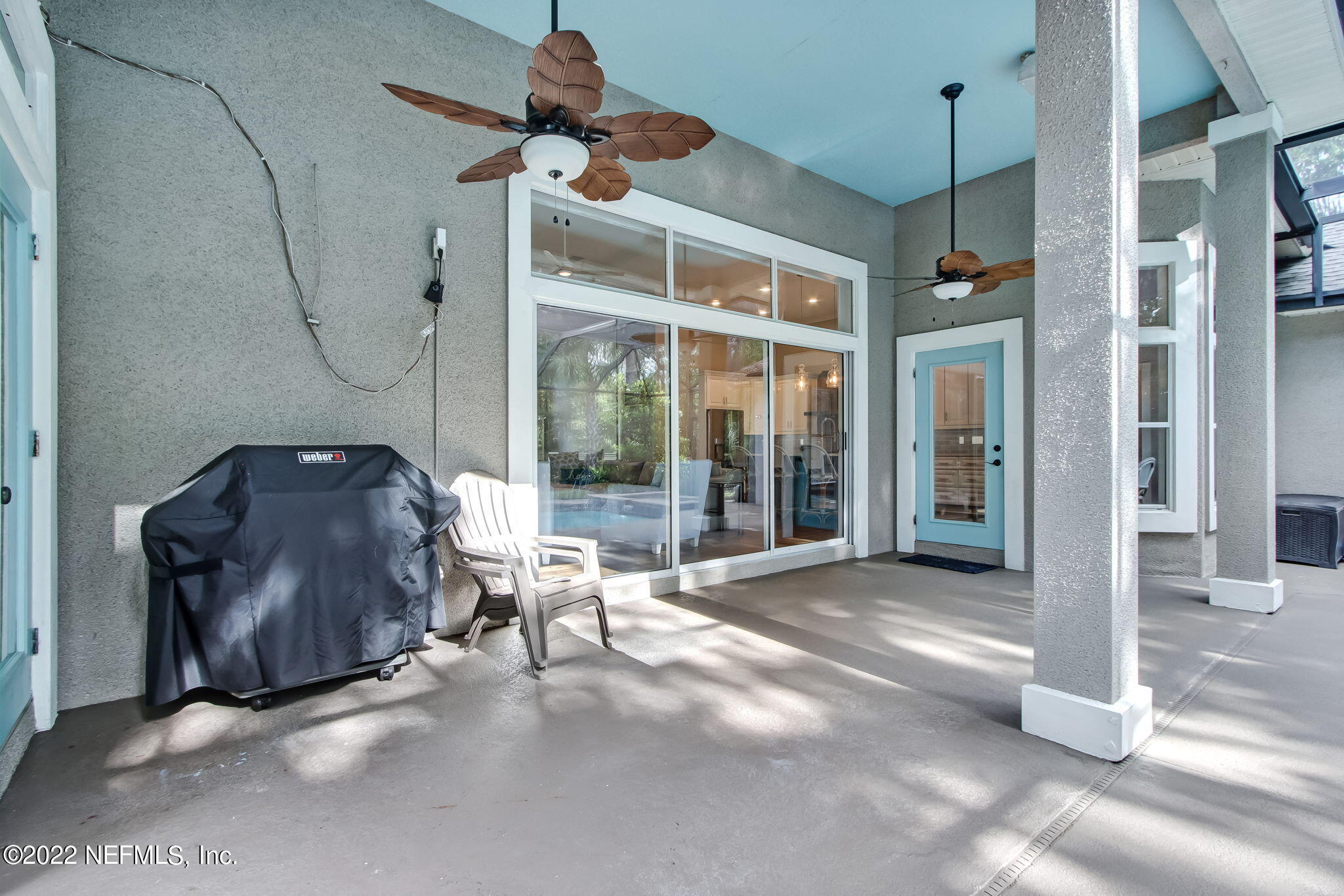 772 Mill Stream Road Ponte Vedra Beach, FL 32082 - Photo 35 of 57 a living room with furniture and a floor to ceiling window