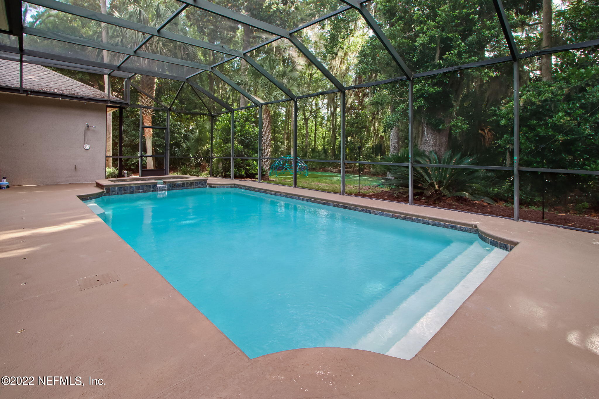 772 Mill Stream Road Ponte Vedra Beach, FL 32082 - Photo 39 of 57 a view of a backyard with a small swimming pool