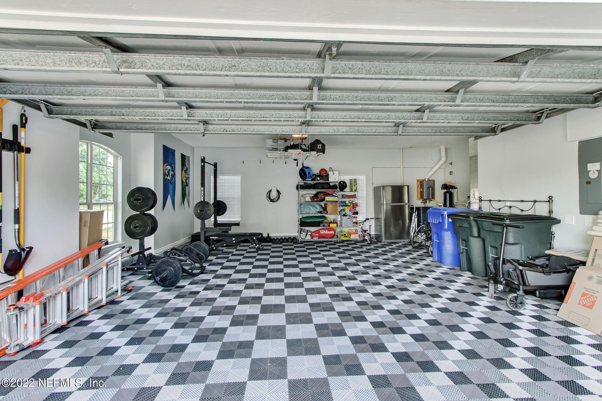772 Mill Stream Road Ponte Vedra Beach, FL 32082 - Photo 45 of 57 a room with lots of white furniture and a chandelier