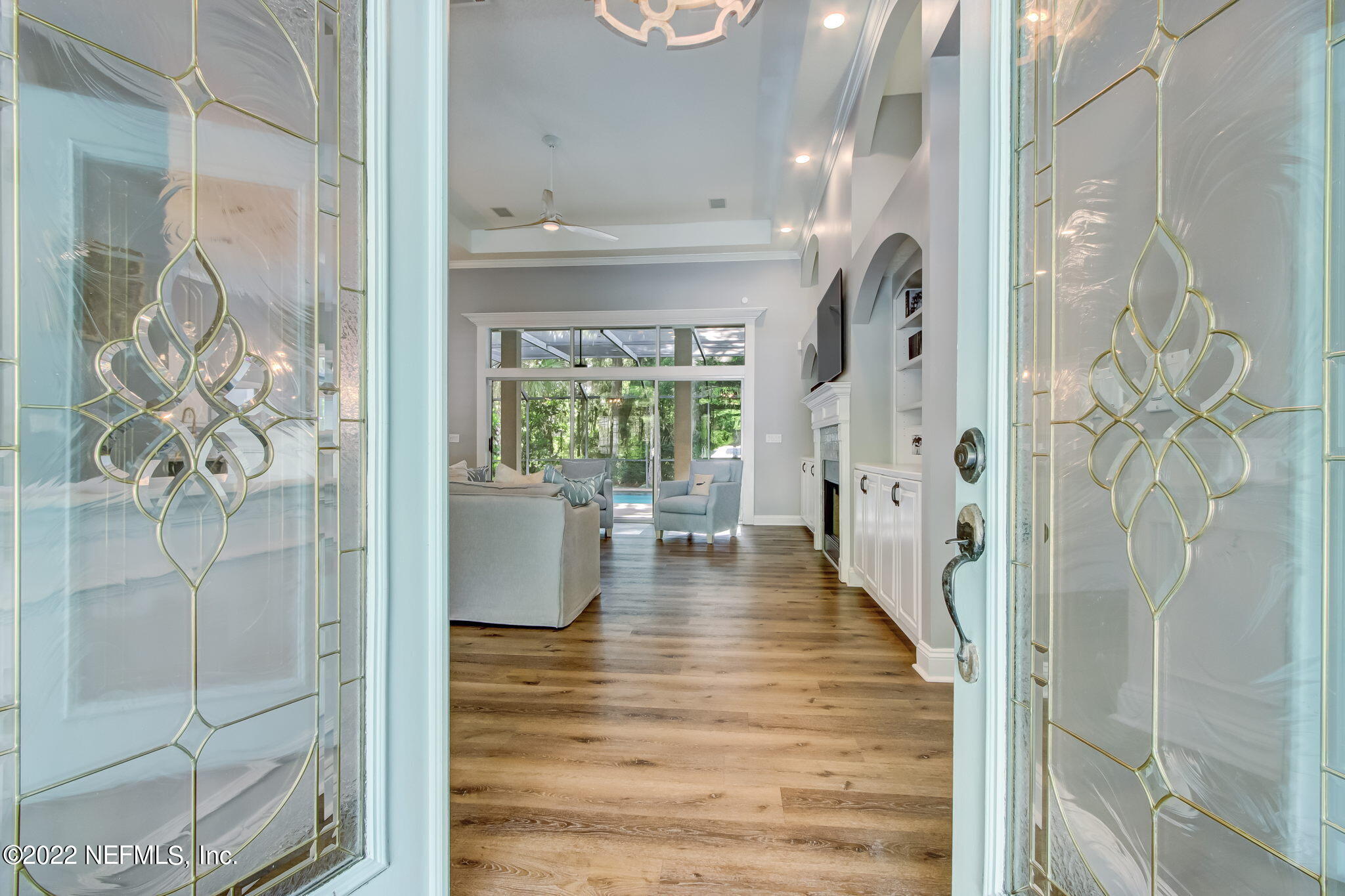 772 Mill Stream Road Ponte Vedra Beach, FL 32082 - Photo 8 of 57 a view of a hallway with wooden floor and a dining room