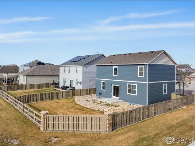 a balcony with a table and chairs