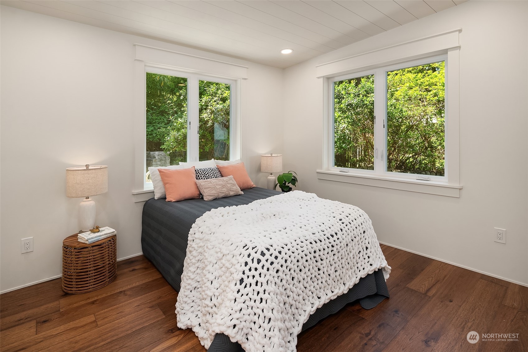 4528 Southwest Luana Beach Road Vashon, WA 98070 - Photo 15 of 27 a bed sitting in a bedroom next to a window