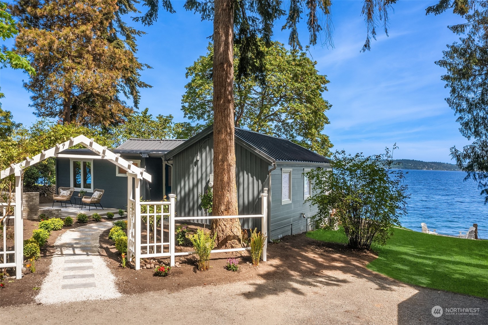 4528 Southwest Luana Beach Road Vashon, WA 98070 - Photo 18 of 27 a front view of a house with garden