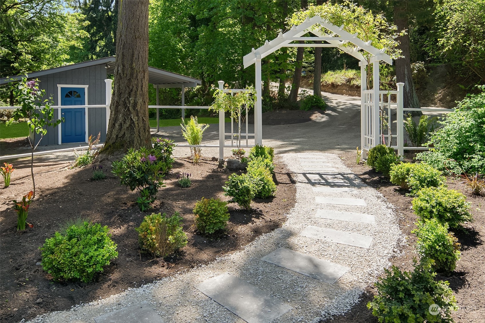 4528 Southwest Luana Beach Road Vashon, WA 98070 - Photo 19 of 27 a front view of a house with garden