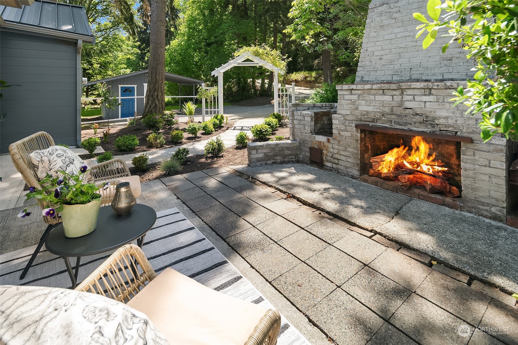 4528 Southwest Luana Beach Road Vashon, WA 98070 - Photo 20 of 27 a view of a porch with chairs and a fire pit