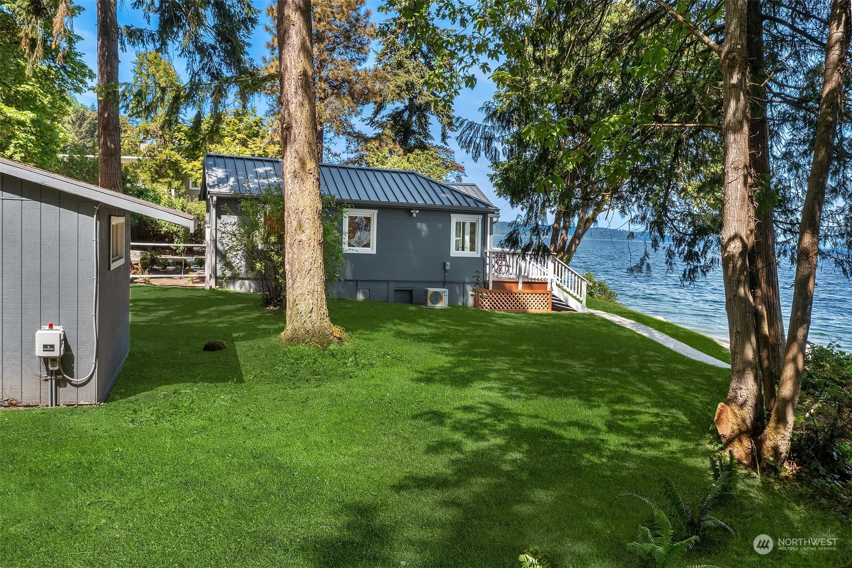 4528 Southwest Luana Beach Road Vashon, WA 98070 - Photo 24 of 27 a front view of a house with garden