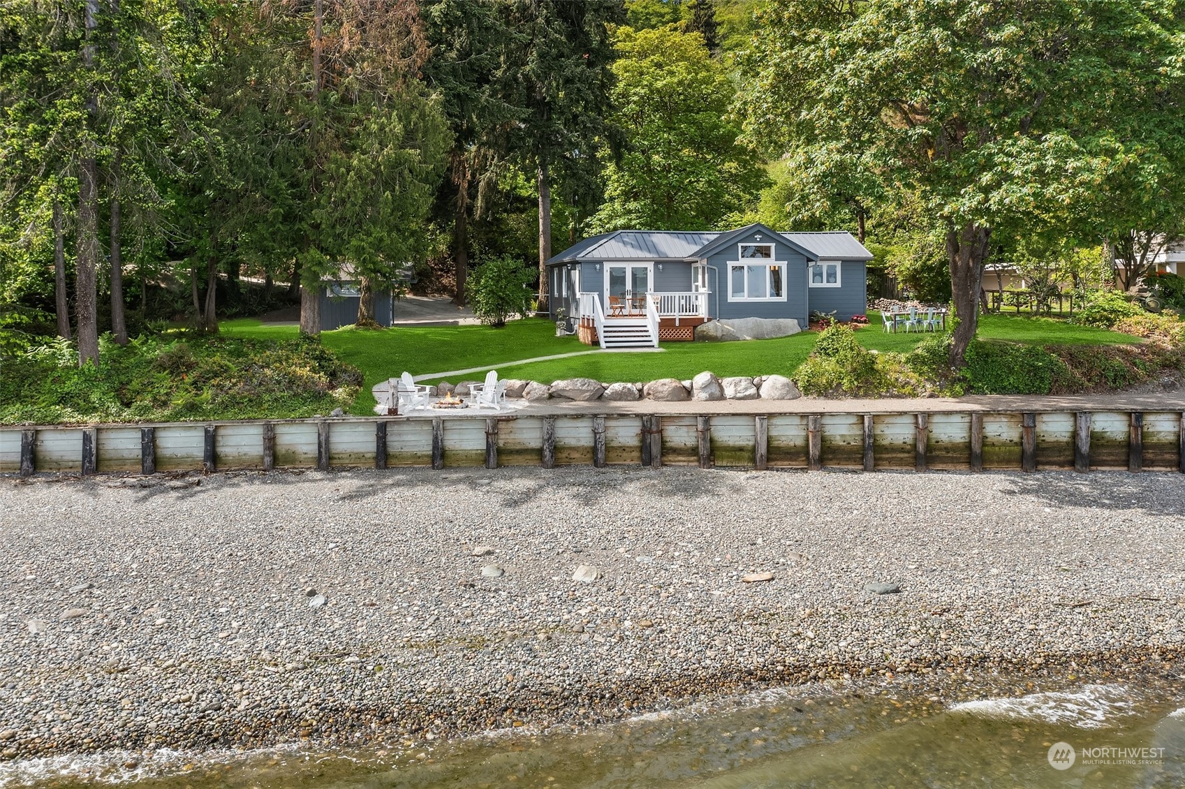 4528 Southwest Luana Beach Road Vashon, WA 98070 - Photo 26 of 27 a front view of a house with garden