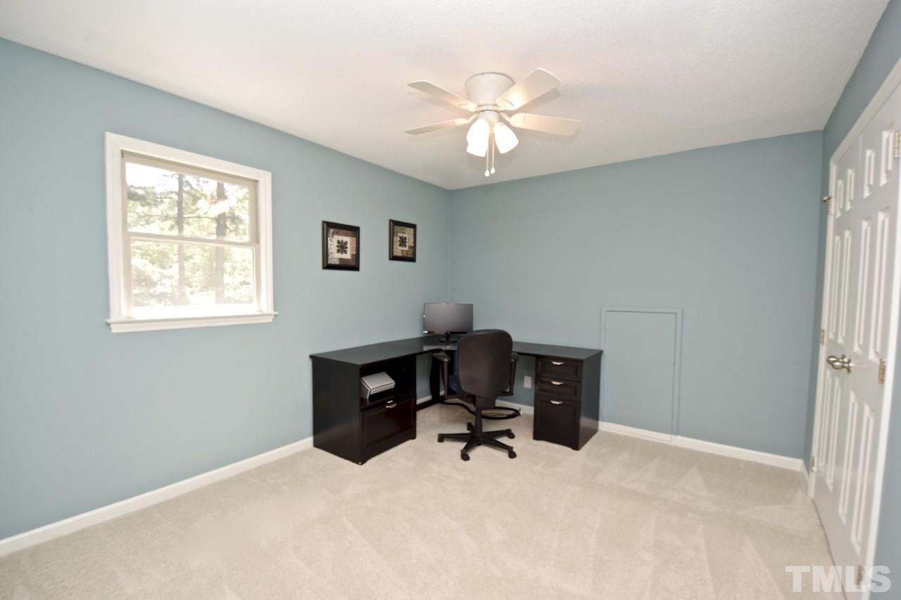 4213 Tolchester Place Raleigh, NC 27613 - Photo 16 of 25 a workspace with furniture and a window