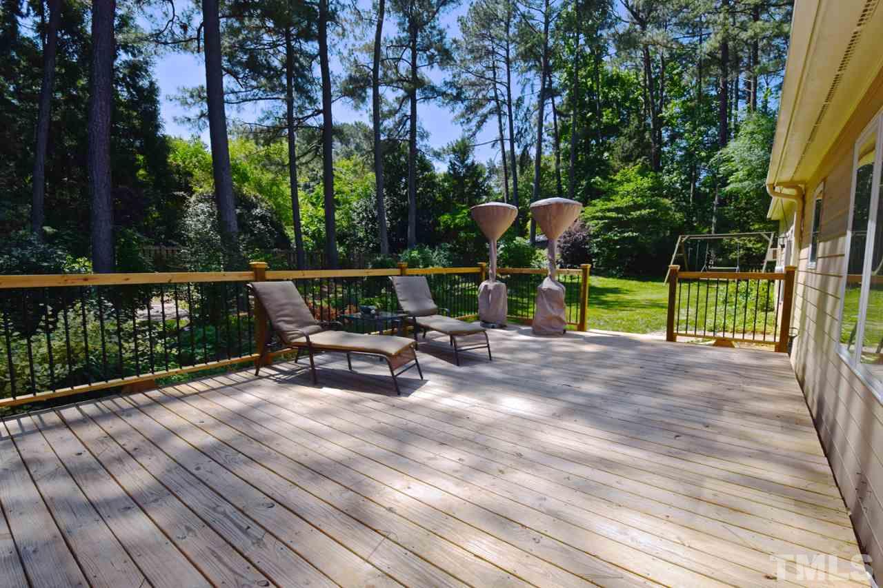 4213 Tolchester Place Raleigh, NC 27613 - Photo 20 of 25 a view of backyard with a table and chairs