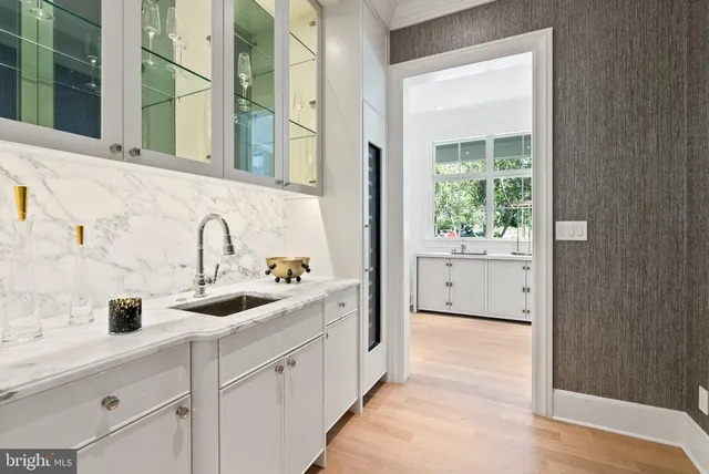 a bathroom with a sink and a window