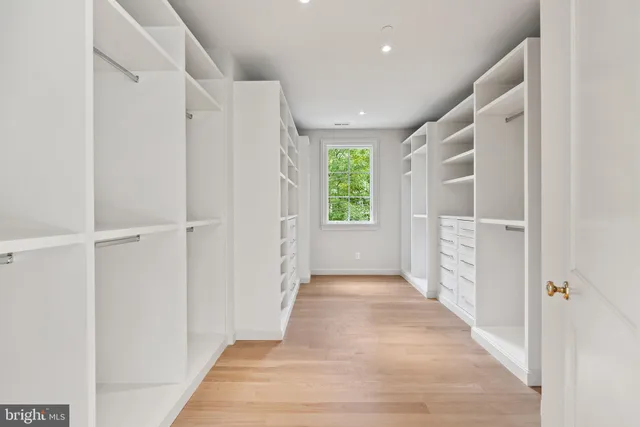 a view of entryway with a window and wooden floor