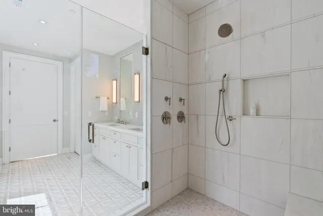 a bathroom with a shower and a sink