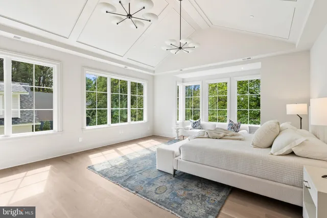 a bedroom with a bed and glass window