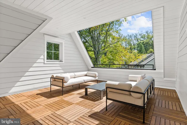 a view of a two chairs in the balcony