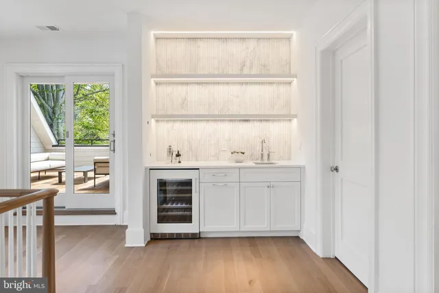 a view of cabinets and wooden floor