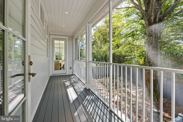 a view of a balcony with wooden floor
