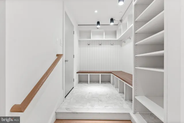 a view of a hallway with staircase