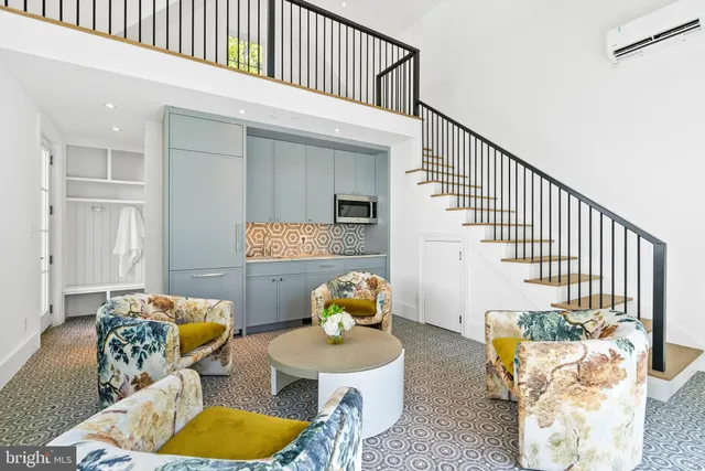a living room with furniture flowerpot and a window
