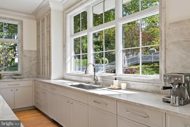 a kitchen with sink and windows
