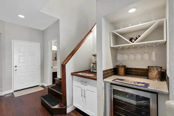 a open kitchen with a stove and a refrigerator