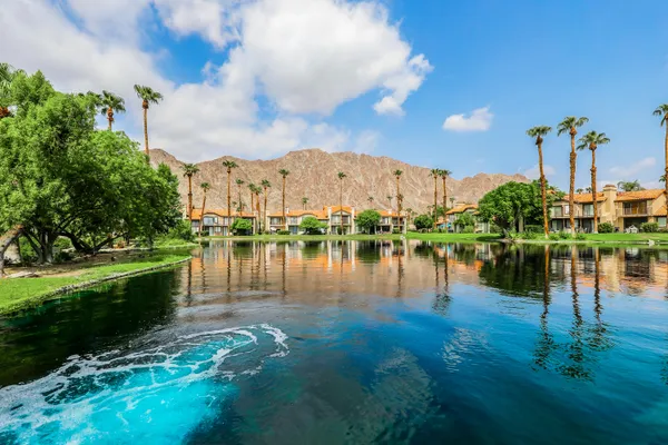 a view of a lake with a house in the background