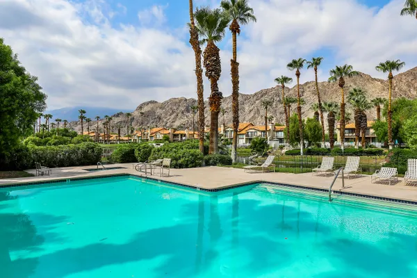 a view of a swimming pool and an outdoor space