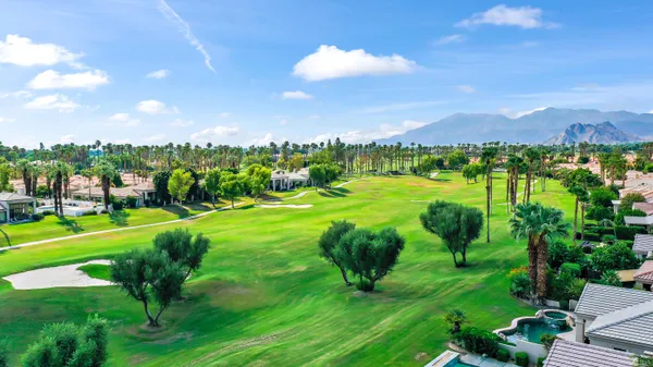 a view of a golf course with a garden