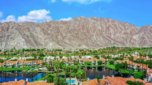 a view of a city with mountains in the background