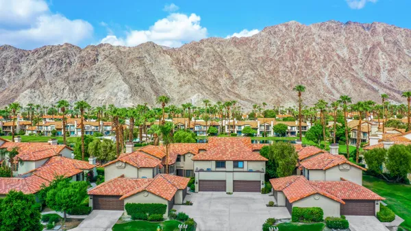 a view of a lake with a house in the background