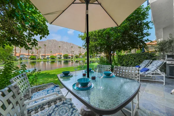 swimming pool view with a seating space
