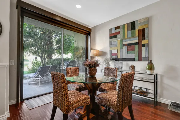 a view of a dining room with furniture window and wooden floor
