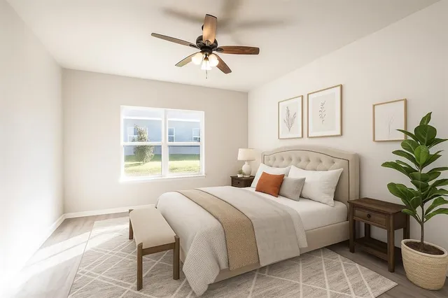 a bedroom with a large bed and a window