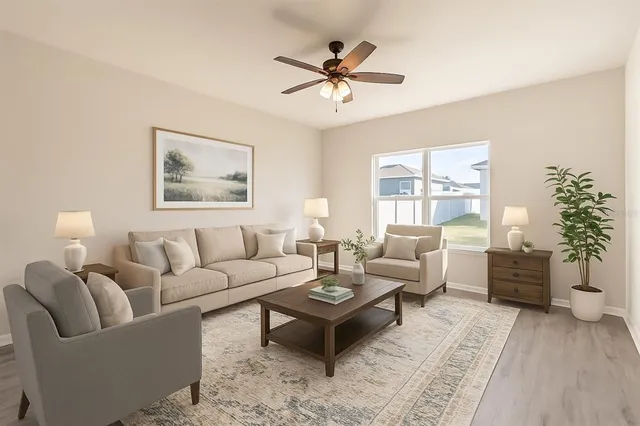 a living room with furniture a chandelier and a window