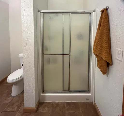 a kitchen with a granite countertop sink a stove and a stove